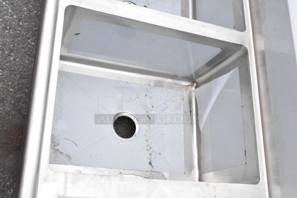 Brand new Regency 600S3182418R stainless steel 3-bay sink, right drain board, no legs, scratch and dent condition.