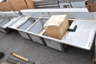 BRAND NEW SCRATCH AND DENT Regency 600S31824218 stainless steel commercial 3 bay sink with dual drain boards.