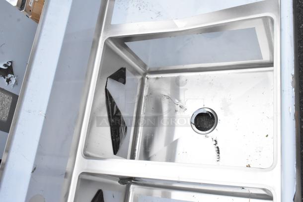 "Regency 600S31824218 stainless steel commercial 3 bay sink with dual drain boards, scratch and dent condition."