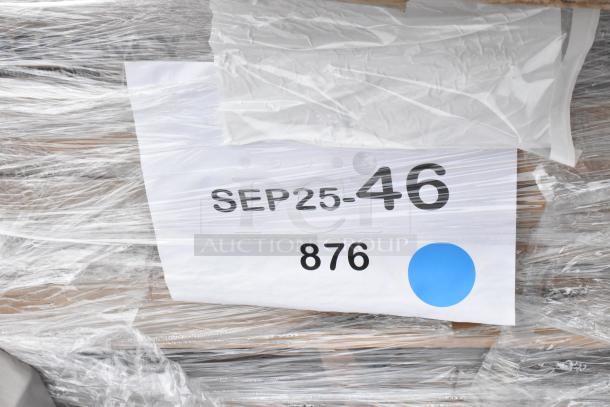 Plastic-wrapped packaging showing label "SEP25-46," number 876, and a blue dot, part of a scratch and dent auction lot.