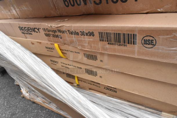 Cardboard boxes labeled Regency 18 Gauge Work Table 30x96 with visible barcodes and NSF marking, slight damage noted.