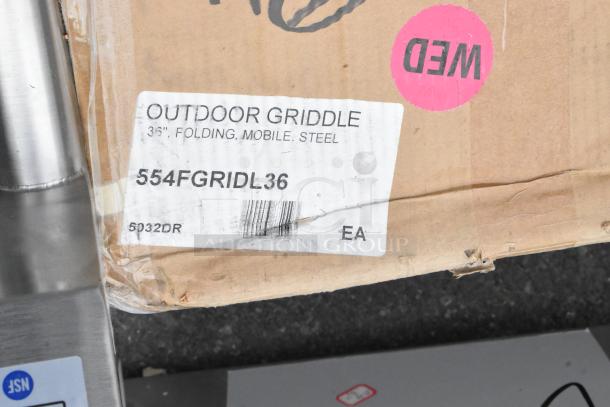 Box label for Backyard Pro 36" Steel Liquid Propane Folding Mobile Outdoor Griddle, showing minor wear and model 554FGRIDL36.