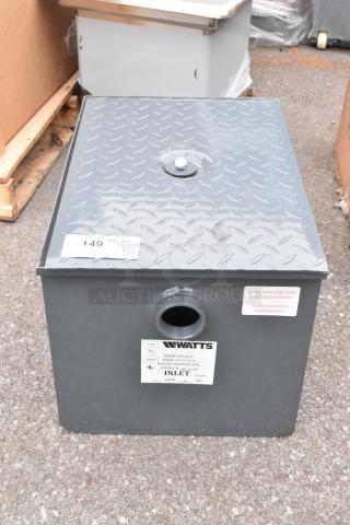 BRAND NEW Watts WD-15-THD 30 lb. grease trap with threaded connections, minor dents, labels detailing specifications.