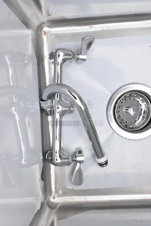 Steelton 522CS11515 stainless steel single bay sink, brand new with scratches, visible faucet, drain, no legs included.