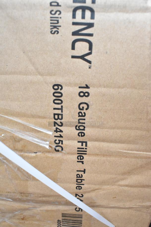 Cardboard packaging labeled "18 Gauge Filler Table 600TB2415G" by Regency, indicating scratch and dent items.