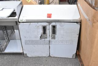 BRAND NEW SCRATCH AND DENT Regency 36" stainless steel wall cabinet with hinged doors, minor dents visible.