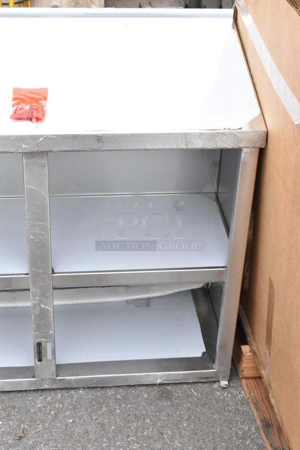 Brand new Regency 600WCH1536 36" stainless steel wall cabinet, minor scratches, hinged doors, includes hardware.