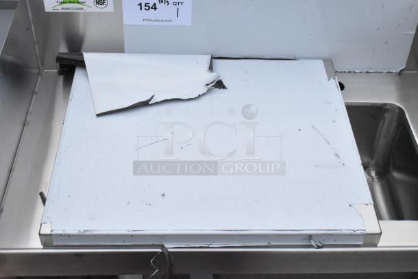 BRAND NEW Regency 600WST1524SB 24" stainless steel bussing station with sink and pan holder, minor dents visible.