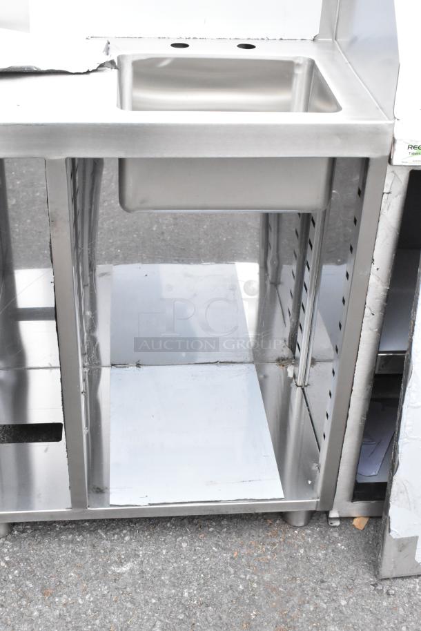Brand new Regency 600WST1524SB 24" stainless steel busing station, includes pan holder and sink, visible minor scratches.