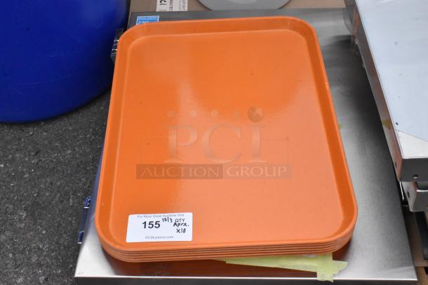 Stack of orange trays, brand new, tagged "Lot 155", approximate quantity 10.