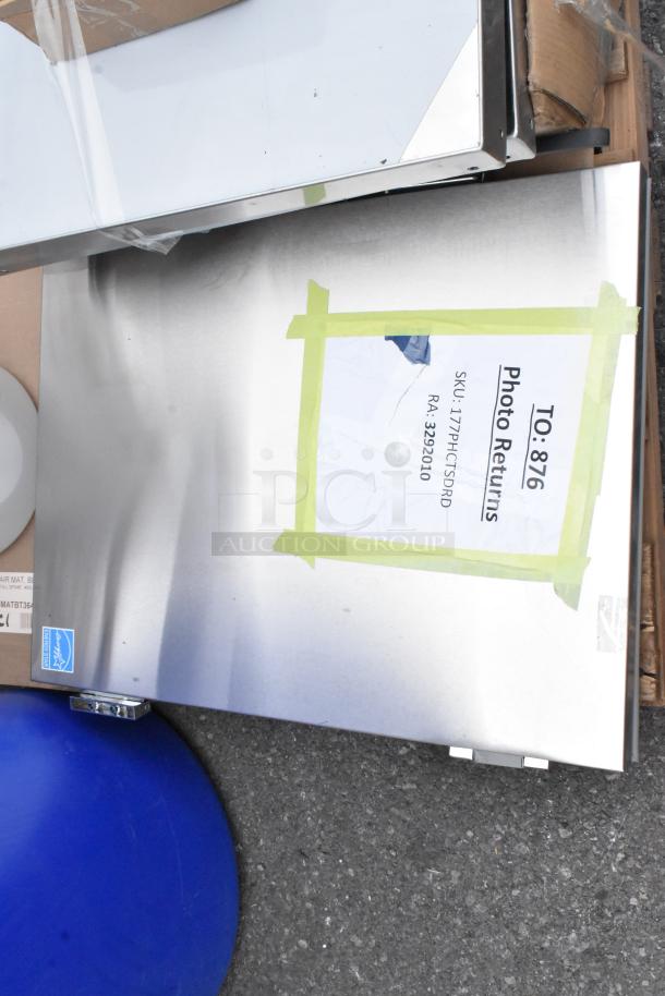 10 brand new scratch-and-dent items, including orange trays and Flash Furniture MAT-124086-GG office chair mat, shown in packaging with some visible labels and markings.