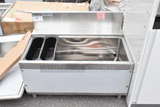 Brand new Regency 600IB2436S Spec Line 24"x36" underbar ice bin, 119 lb capacity, with minor scratches and dents.