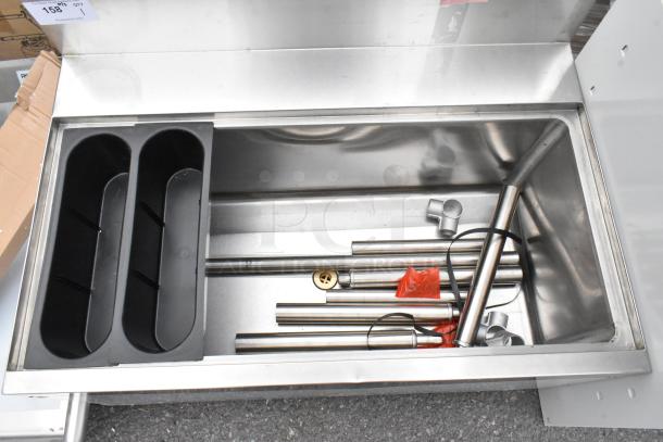 Regency 600IB2436S underbar ice bin, 24" x 36", 119 lb capacity, new with scratches and dents, stainless steel.