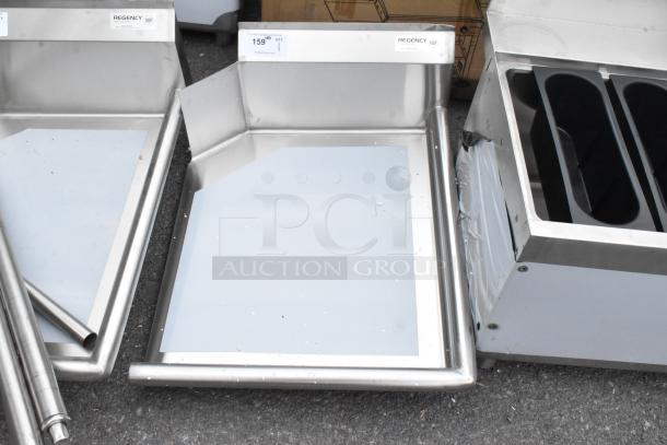 Brand new Regency 600CDT24R 16 gauge 2' clean dish table with right drainboard; scratches and dents visible; NSF certified.