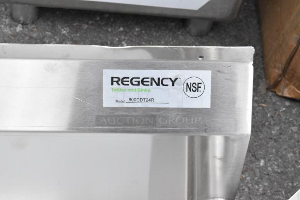 BRAND NEW Regency 600CDT24R 16 Gauge 2' Clean Dish Table with right drainboard; features scratches, NSF certified.