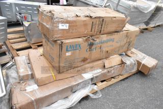Boxes of brand new scratch and dent items include Lavex housekeeping cart, Regency stainless steel table, and table base.