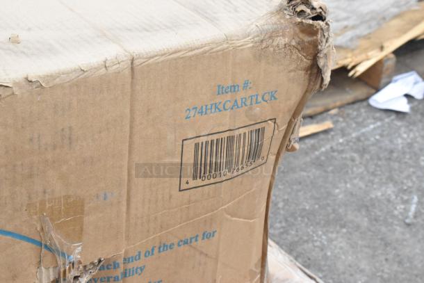 Damaged shipping box with item code 274HKCARTLCK visible. Packaging is dented and torn at corners.