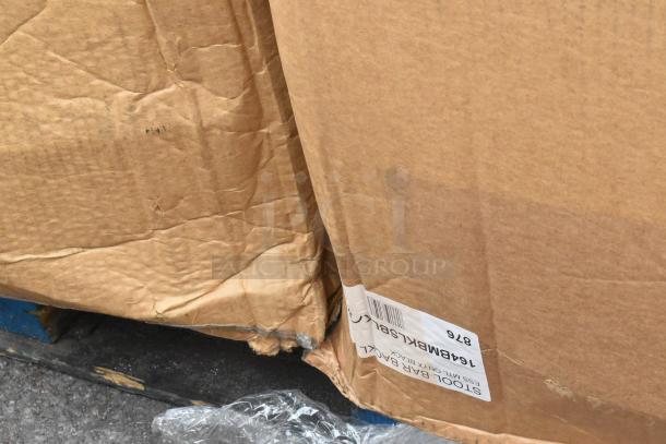 Cardboard box with visible label for model 164BMBKLSBLK, showing signs of damage. Contains Lancaster Table & Seating item.