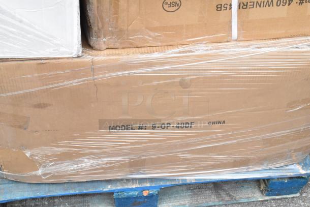 Stack of boxed items wrapped in plastic on a pallet, visible label reads “MODEL #: 9-OP-48DF CHINA.”