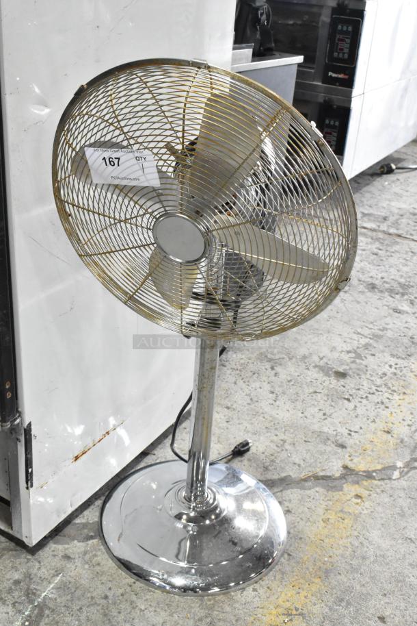 HIFANXSTAND16METALF metal floor fan, 120V, 1 phase. Standing style, chrome finish, visible wear, auction tag "167" attached.
