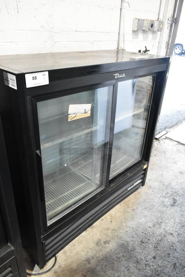 2019 True 2 Door Reach-In Cooler Merchandiser, poly-coated racks, 115V, good condition, visible brand logo.