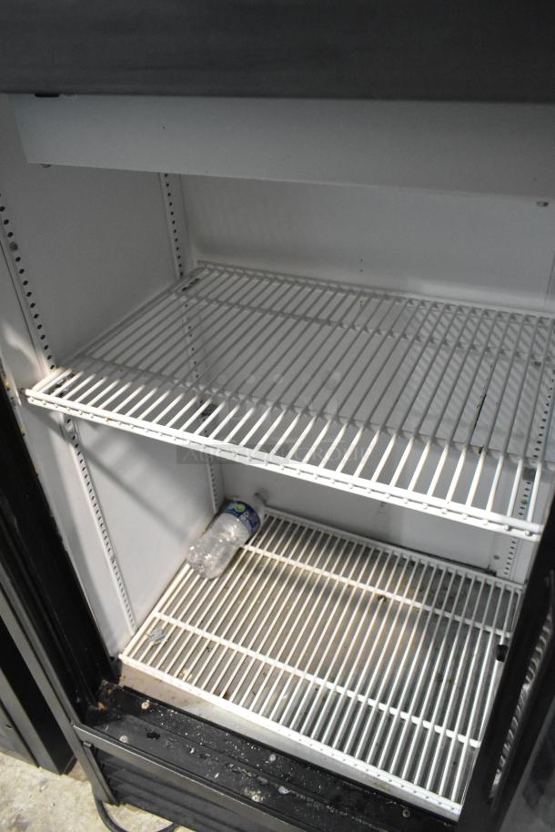 2019 True Metal 2 Door Cooler Merchandiser with poly-coated racks, 115 volts, 1 phase. Interior visible, good condition.