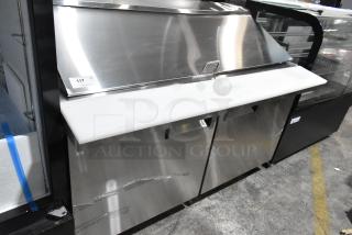 BRAND NEW SCRATCH AND DENT! Avantco 178APT60MHC stainless steel 2-door refrigerated sandwich prep table on casters.