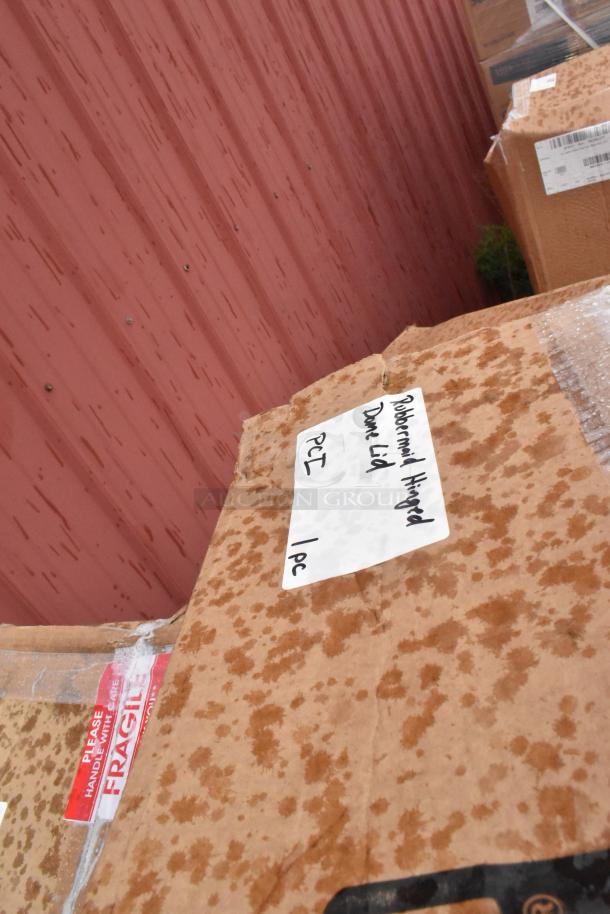 Cardboard boxes labeled "Rubbermaid Hinged Dome Lid" and "Fragile." Boxes are new but show some water stains.