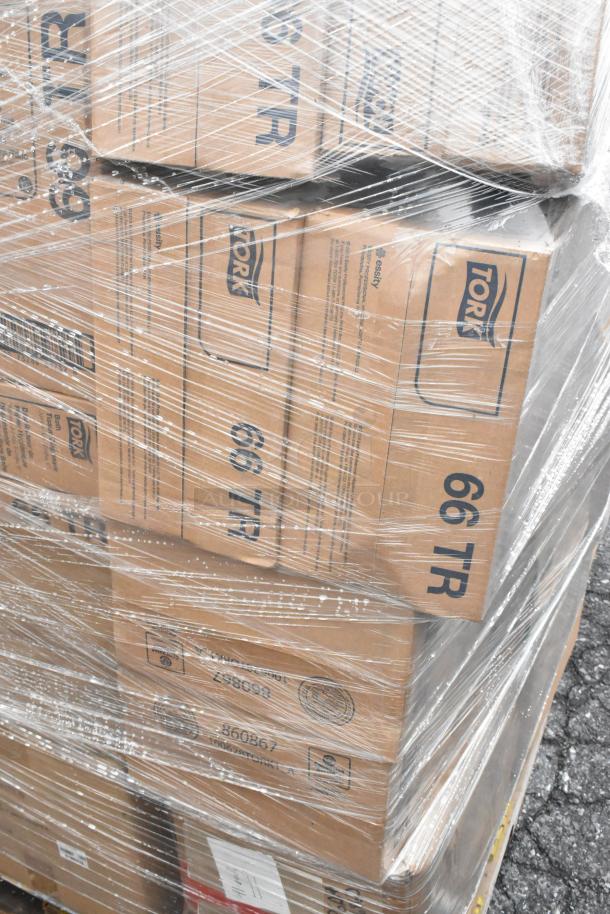 Pallet of 43 brand new scratch and dent boxes in shrink wrap, featuring Tork labels, including bath tissue dispensers and dolly.
