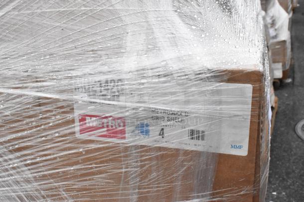 Four stacked boxes wrapped in plastic, containing MetroMax Q Grid Shelf. Boxes are labeled "METRO" and "MMF."
