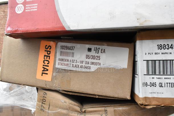 Boxes of scratch and dent items, including ramekins with labels "Ramekin 4 oz, 3-1/8" Dia Smooth." Special tag visible.
