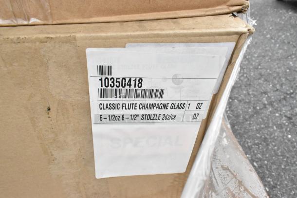 Cardboard box with label showing "Classic Flute Champagne Glass" by Stolzle, 1 dozen, 8-1/2" size, 6-1/2oz capacity.