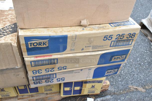 21 boxes labeled "Tork" and "12 oz. Peacock Blue Coffee Mug," on pallets. Some boxes show signs of wear.