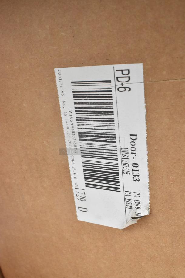 Cardboard box with a barcode label reading "PD-6," part of a lot including plates and a lamp warmer, in scratch and dent condition.