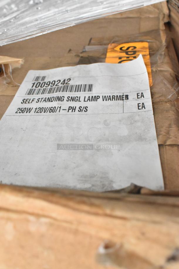 Cardboard box label showing "Self Standing Lamp Warmer, 250W 120V," indicating scratch and dent condition.