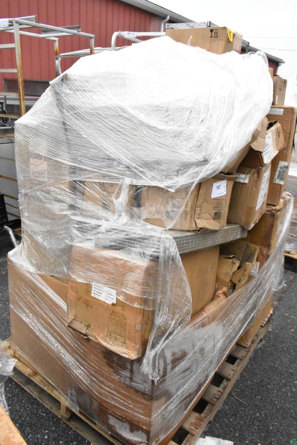 25 wrapped boxes including wrought iron chafer, glasses, Fiesta dishes. New scratch and dent items on a shipping pallet.
