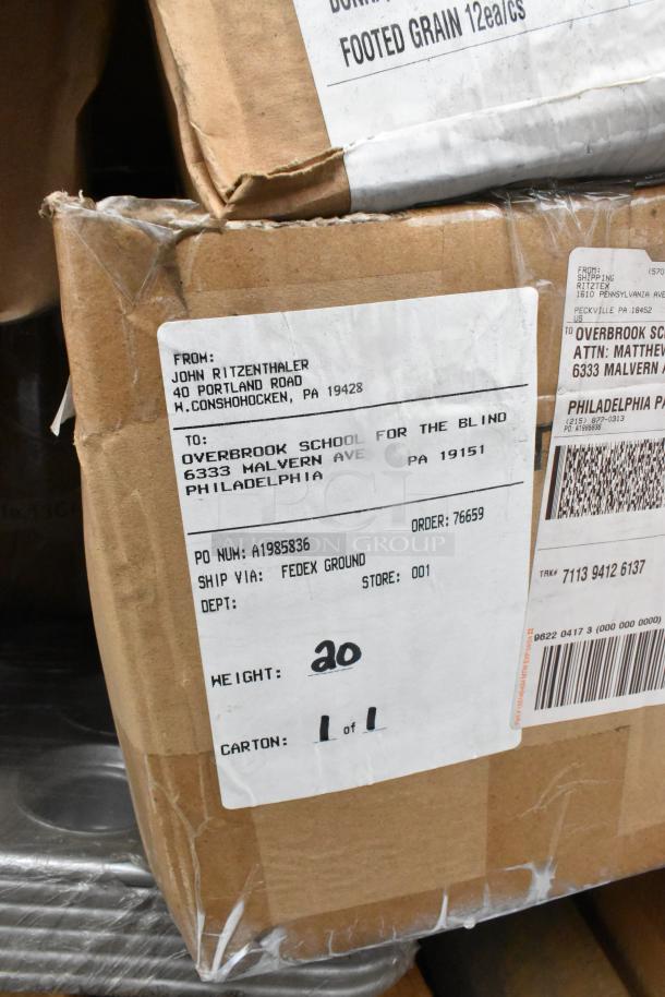 Cardboard box with shipping labels, marked "John Ritzenthaler, 40 Portland Road, W. Conshohocken, PA." Contains scratch and dent items.