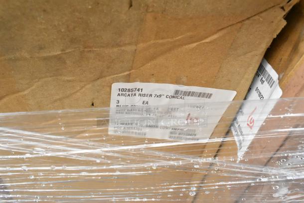 Brown cardboard box wrapped in plastic, with visible label "Arcata Riser 7x9" Conical." Part of a 25-item mixed lot.