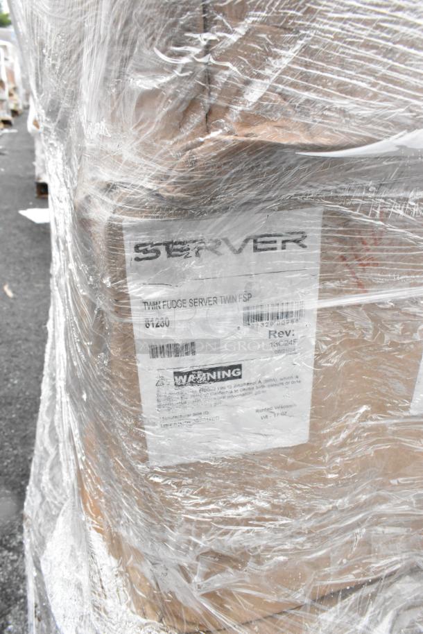 Plastic-wrapped pallet of scratch and dent boxes labeled "Twin Fudge Server," SKU 61250, with cautionary label visible.