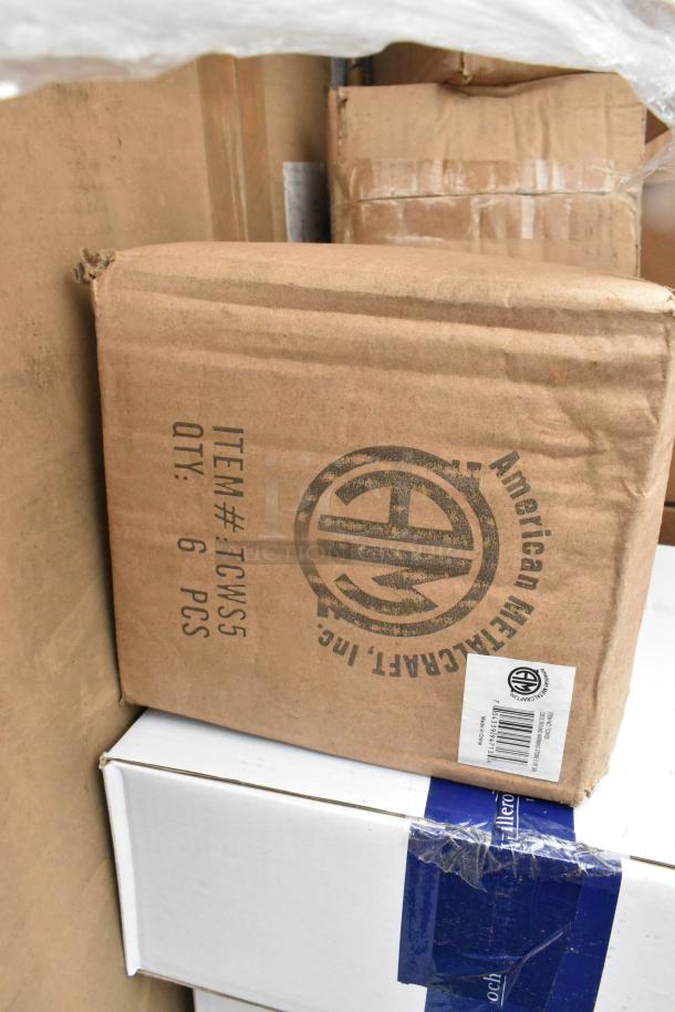 Boxes of new scratch and dent items including plates, servers, glasses, and steak knives. American Metalcraft branding.