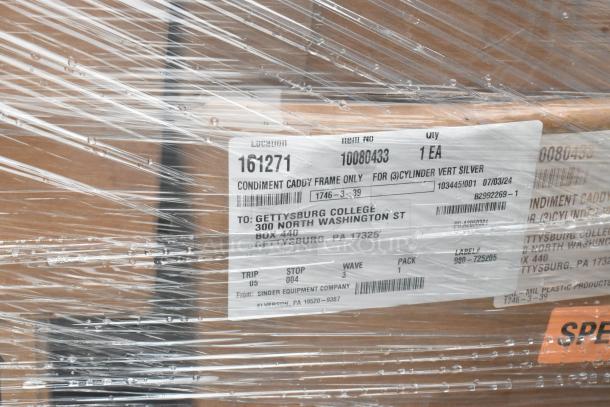 Auction lot featuring 29 boxes, including a condiment caddy frame. Label shows delivery to Gettysburg College. Brand new, some scratch and dent.