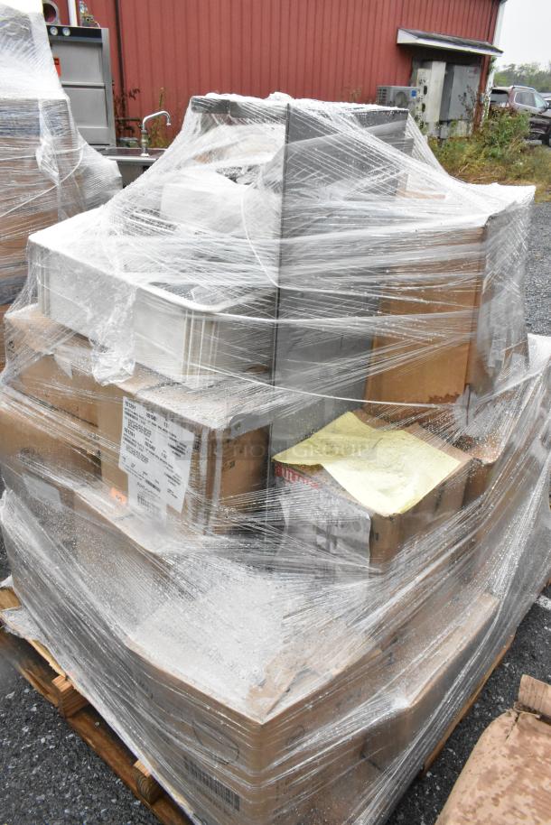 27 scratch and dent boxes of plates and bowls wrapped on a pallet, ready for auction. Slight box damage visible.