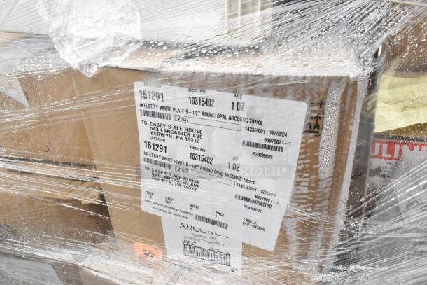27 brand new scratch and dent boxes wrapped in plastic, labeled "Intesity White Plate 9-1/2" Round Opal Arcroc."