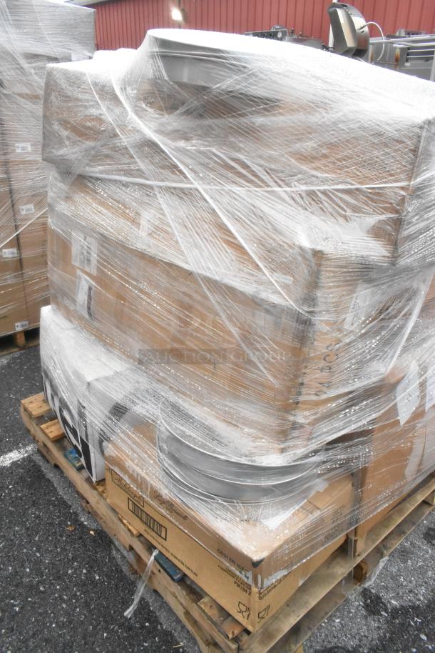 Pallet with 18 shrink-wrapped boxes, including heat lamp and dispenser. Scratch and dent condition, various tags visible.