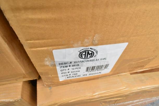 Cardboard box labeled with "American Metalcraft," containing 12 multi-function risers, black, 12-1/8"L. Made in India.