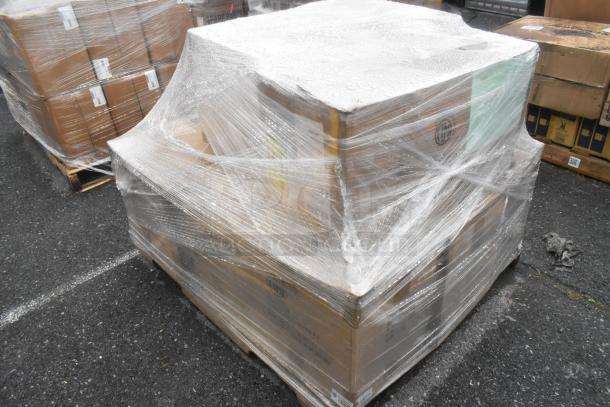 Pallet with 13 new scratch and dent boxes, including risers and baskets, wrapped in plastic, on asphalt surface.