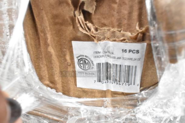 Cardboard box with label from American Metalcraft, 16 glass jars, 24 oz each, visible wear, wrapped in plastic, Made in China.