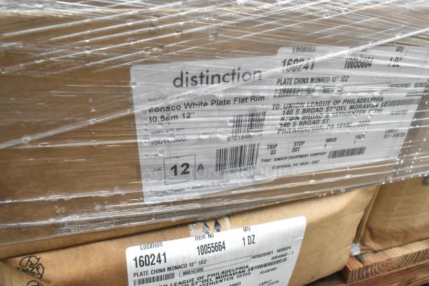 Boxes of "Monaco White Plate Flat Rim" dishes, 12-inch, 1 dozen per box, labeled by Singer Equipment Company.