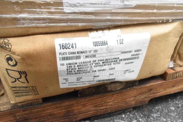 Boxes of plates labeled "Plate China Monaco 12" 1DZ," in cardboard packaging on wooden pallet. Tags indicate destination as Union League of Philadelphia.