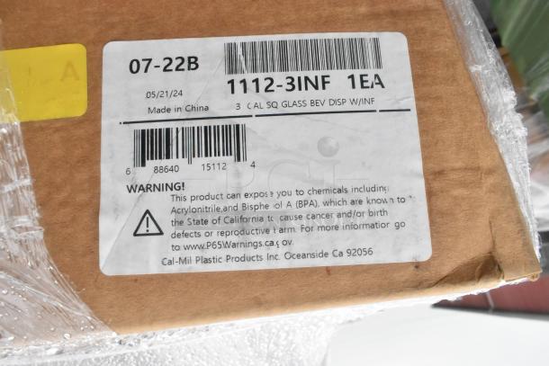 Label on a box indicating "3 CAL SQ GLASS BEV DISP W/INF" and a warning about chemical exposure. Made by Cal-Mil Plastic Products.